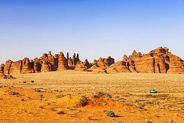 Vintage Land Rover Tour in the rocky landscape of Hegra, Unesco World Heritage Site Al Ula, Kingdom of Saudi Arabia