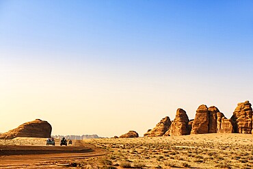 Vintage Land Rover Tour in the rocky landscape of Hegra, Unesco World Heritage Site Al Ula, Kingdom of Saudi Arabia