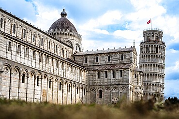 Historic architecture with the Leaning Tower of Pisa under a blue sky, Pisa, Italy