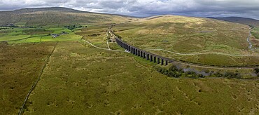 Ribblehead Viaduct, railway viaduct in the Yorkshire Dales, behind Whernside mountain, drone shot, Carnforth, England, Great Britain