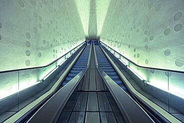 Futuristic-looking escalator in a symmetrical, blue-illuminated tunnel, Elbphilharmonie, concert hall, Hamburg, Free and Hanseatic City of Hamburg, Germany