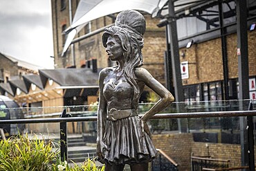Bronze statue of the late singer Amy Winehouse, standing proudly in stables market, Camden town, London
