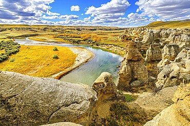 Weathered sandstone rock formations along the Milk River in Writing-On-Stone Provinvial Park, Alberta, Canada