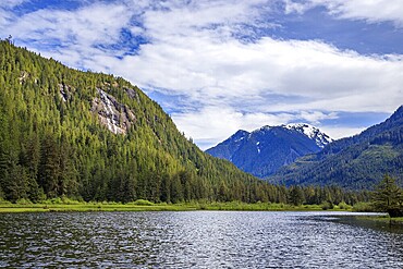 Waterfalls on the cliffs overlooking the scenic Stafford Estuary Conservancy at the head of Loughborough Inlet, on the west coast of British Columbia, Canada