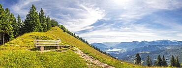 Panorama landscape with mountains with wooden bench and footpath, the Zwolferhorn mountain and Lake Wolfgangsee, Alps, Austria