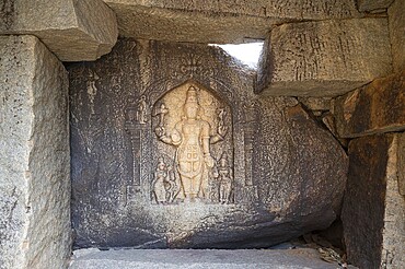 Ancient sculpture at a temple of Hampi, carved into boulder of Tungabhadra river, hindu religion, god, ganesh at ruin of Vijayanagara Empire