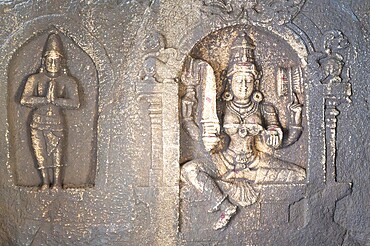 Ancient sculpture at a temple of Hampi, carved into boulder of Tungabhadra river, hindu religion, Lakshmi Narasimha shiva at ruin of Vijayanagara Empire