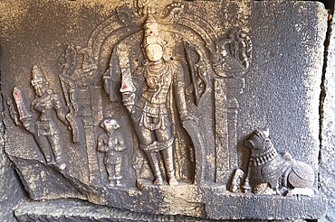 Ancient sculpture at a temple of Hampi, carved into boulder of Tungabhadra river, hindu religion, Lakshmi Narasimha shiva at ruin of Vijayanagara Empire