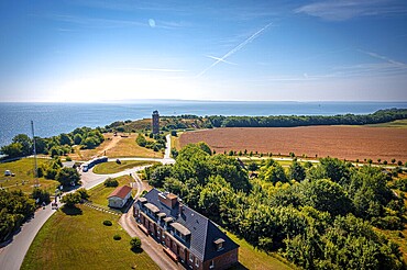Coastal landscape with a road, a tower, houses and a view of the blue sea under a clear sky, Rügen Island, Cape Arkona, Mecklenburg-Western Pomerania, Germany