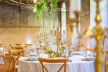Elegant and romantic wedding tables with candles and natural decoration, event and wedding location Kloster Lorch, Lorch, Germany