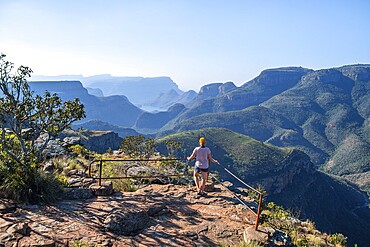 Tourist at the viewpoint, view of the Blyde River gorge, Lowveld Viewpoint, in the evening light, canyon landscape, Blyde River Canyon, Panorama Route, Mpumalanga, South Africa