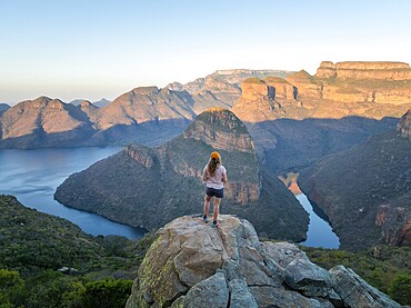 Hiker enjoying panorama, Blyde River Canyon with summit Three Rondawels, view of canyon with river Blyde River and table mountains, canyon landscape, Panorama Route, Mpumalanga, South Africa