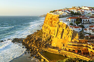 Azenhas do Mar Village in Portugal at Fiery Sunset, Cliffs and Waves of Atlantic Ocean