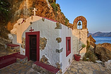 Legend, crab, shell fisherman, coastal chapel with arch and bell, surrounded by rocks and seascape, chapel, small church, Agia Kavouradena Monastery, Xirokambos, Leros, Dodecanese, Greek Islands, Greece
