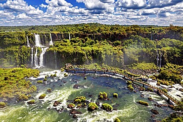 Expansive aerial view over river landscape with waterfalls and dense forest, The Iguazu Falls between Argentina and Brazil