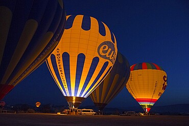 Hot air balloons at night with colourful lighting, creating a fascinating and atmospheric ambience, Göreme National Park, Göreme Tarihî Millî Parkı, Nevsehir Province, Nevşehir, Cappadocia, Cappadocia, Cappadocia, Cappadocia, Central Anatolia, Turkey