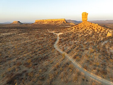 The Vingerklip (rock finger) and the Ugab Valley Terraces are surrounded by thornbush and mopane (Colophospermum mopane) savanna. Aerial view. Drone shot. Damaraland, Namibia