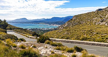 A road among the mountains on the Formentor peninsula in Mallorca. In the background the sea and mountains