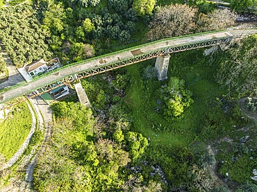 Cycle path Via Verde Del Aceite, old railroad track leading over a bridge, at village Zuheros, Andalusia, Spain