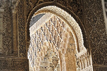 Alhambra, Granada, Andalusia, Spain, Europe, Detailed view of an ornate arch with complex Moorish ornamentation in the Alhambra