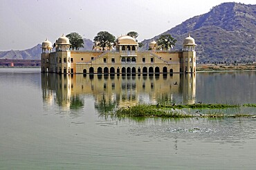 Water palace Jal Mahal, Jaipur, Rajasthan, North India, Asia, A palace rests in the water, surrounded by a peaceful landscape and hills in the background, India