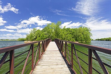 Riverscape, footbridge to a small island in the Saint Lawrence River, Province of Quebec, Canada