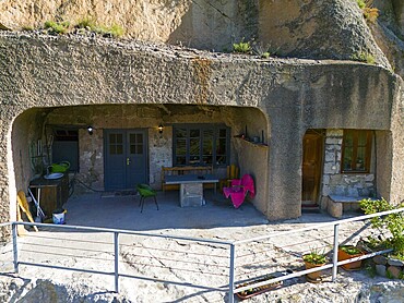 Cosy cave dwelling with rustic style and furniture, surrounded by plants and rocky surroundings, aerial view, inhabited monk caves, cave town, cave monastery, Vardzia, Vardzia, Samtskhe-Javakheti region, Samtske Javakheti, Lesser Caucasus, Georgia