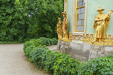 Golden baroque sculptures adorn a pavilion on the garden path, potsdam, brandenburg, germany