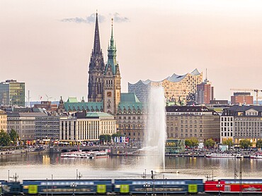 Aerial view of the Inner Alster with Kennedy Bridge, Alster Fountain, Jungfernstieg, City Hall and Elbphilharmonie at sunset, Hamburg, Germany