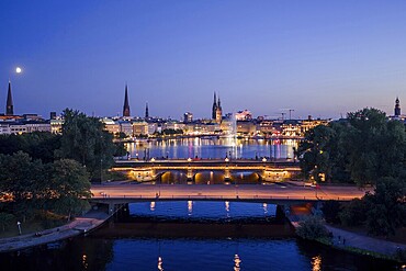 Aerial view of the Outer Alster and Inner Alster with Kennedy Bridge, Alster Fountain, Jungfernstieg, City Hall and Elbphilharmonie at blue hour, Hamburg, Germany