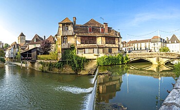 Picturesque view of the canal flowing through salies de bearn, a charming village located in the pyrenees atlantiques department of france