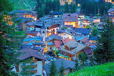 View over town at dusk, Canazei, Val di Fassa, Trentino-Alto Adige, Italy, Europe