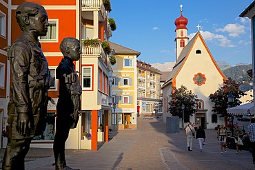 Street sculpture and Little Church, Ortisei, Gardena Valley, Bolzano Province, Trentino-Alto Adige/South Tyrol, Italian Dolomites, Italy, Europe