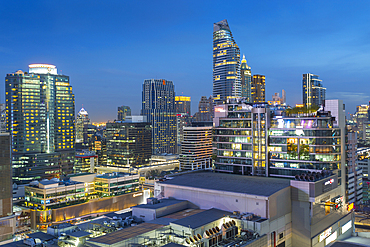 City skyline at dusk from hotel rooftop bar, Bangkok, Thailand, Southeast Asia, Asia