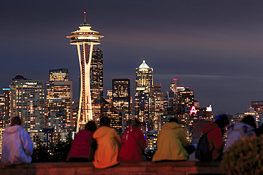 Seattle city skyline at night with illuminated office buildings and Space Needle viewed from public garden near Kerry Park, Seattle, Washington State, United States of America, North America