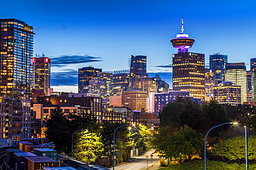 View of city skyline and Vancouver Lookout Tower at dusk from Portside, Vancouver, British Columbia, Canada, North America