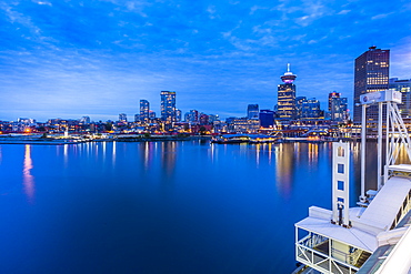 City skyline including Vancouver Lookout Tower as viewed from Canada Place at dusk, Vancouver, British Columbia, Canada, North America