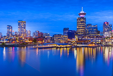 City skyline including Vancouver Lookout Tower as viewed from Canada Place at dusk, Vancouver, British Columbia, Canada, North America