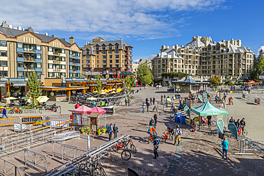 Visitors on Skiers Plaza and Village Stroll at dusk, Whistler, British Columbia, Canada, North America