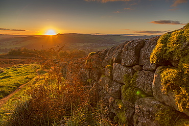 View of sunset from dry stone wall on Baslow Edge, Baslow, Peak District National Park, Derbyshire, England, United Kingdom, Europe