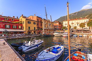 View of boats in Malcesine Harbour by the Lake, Malcesine, Lake Garda, Veneto, Italian Lakes, Italy, Europe