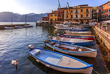 View of boats in Malcesine Harbour by the Lake, Malcesine, Lake Garda, Veneto, Italian Lakes, Italy, Europe