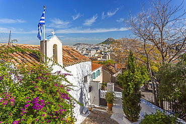 View of Athens and Likavitos Hill over the rooftops of the Plaka District, Athens, Greece, Europe