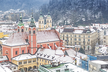 View of snow covered Franciscan Church of the Annunciation from The Skyscraper, Ljubljana, Slovenia, Europe