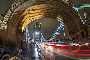 Fisheye view of traffic trail lights on Tower Bridge at night, Southwark, London, England, United Kingdom, Europe