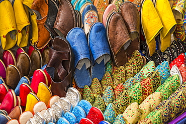 Colourful souvenir shoes for sale in the Market At Rahba Qedima, Marrakesh (Marrakech), Morocco, North Africa, Africa