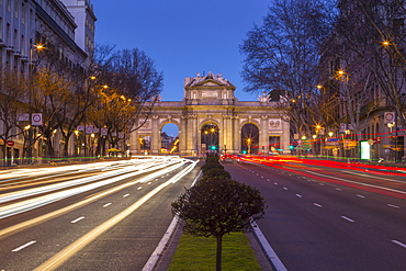 View of trail lights and Plaza de la Independencia at dusk, Madrid, Spain, Europe