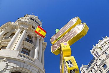 View of sign and Metropolis Building on Gran Via, Madrid, Spain, Europe