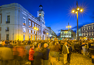 View of Real Casa de Correos and Easter Parade in Puerta del Sol at dusk, Madrid, Spain, Europe