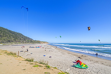 View of windsurfers on beach on Highway 1 near Davenport, California, United States of America, North America